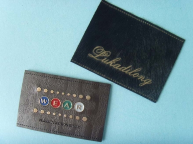 custom debossed jeans leather label with metal logo